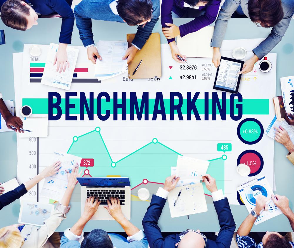 How does energy benchmarking support regulatory compliance?